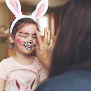 Little girl having a rabbit painting face